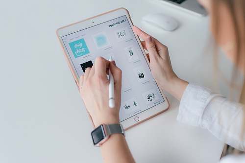mobile phone woman using rose gold iPad cell phone
